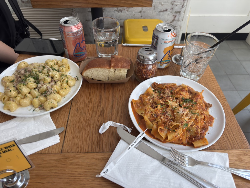 Pappardelle Bolognese and another fresh pasta dish served with bread