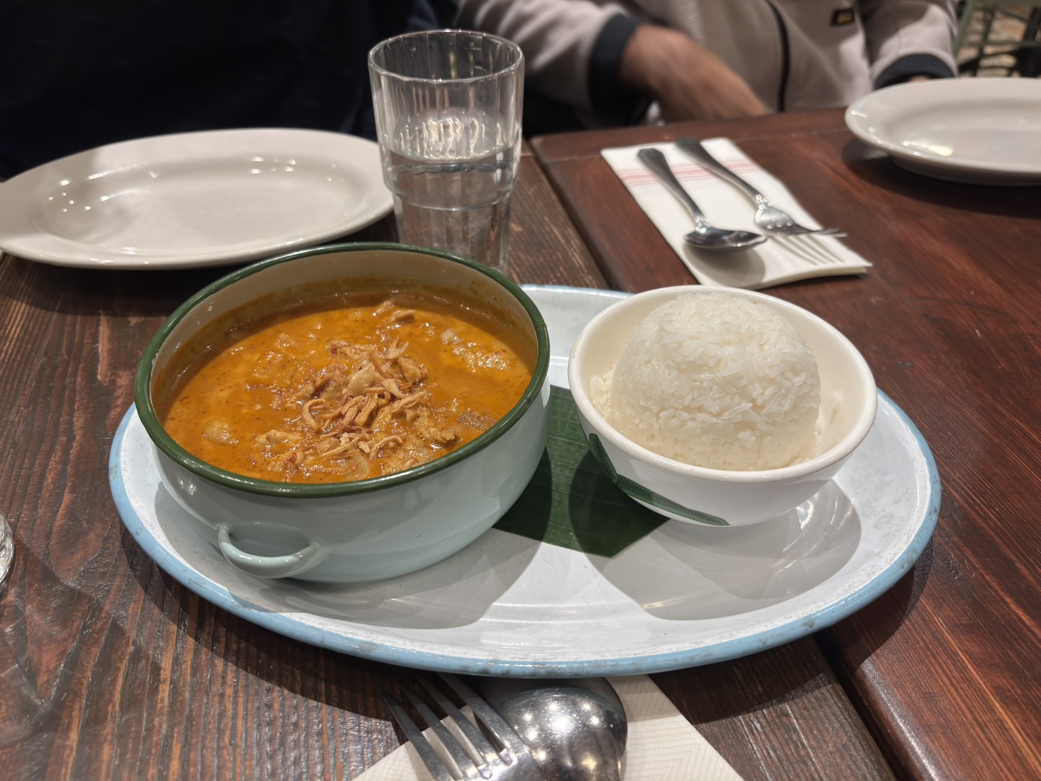 Masaman curry with pork served alongside jasmine rice