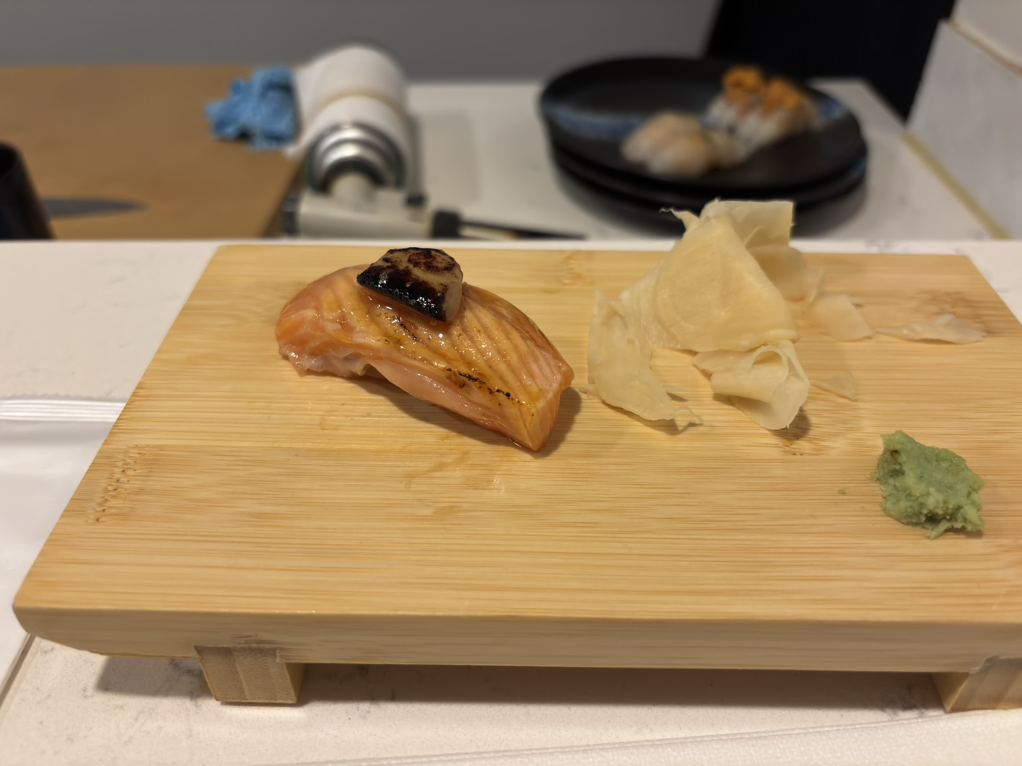 Torched salmon nigiri topped with foie gras at Shinzo Omakase