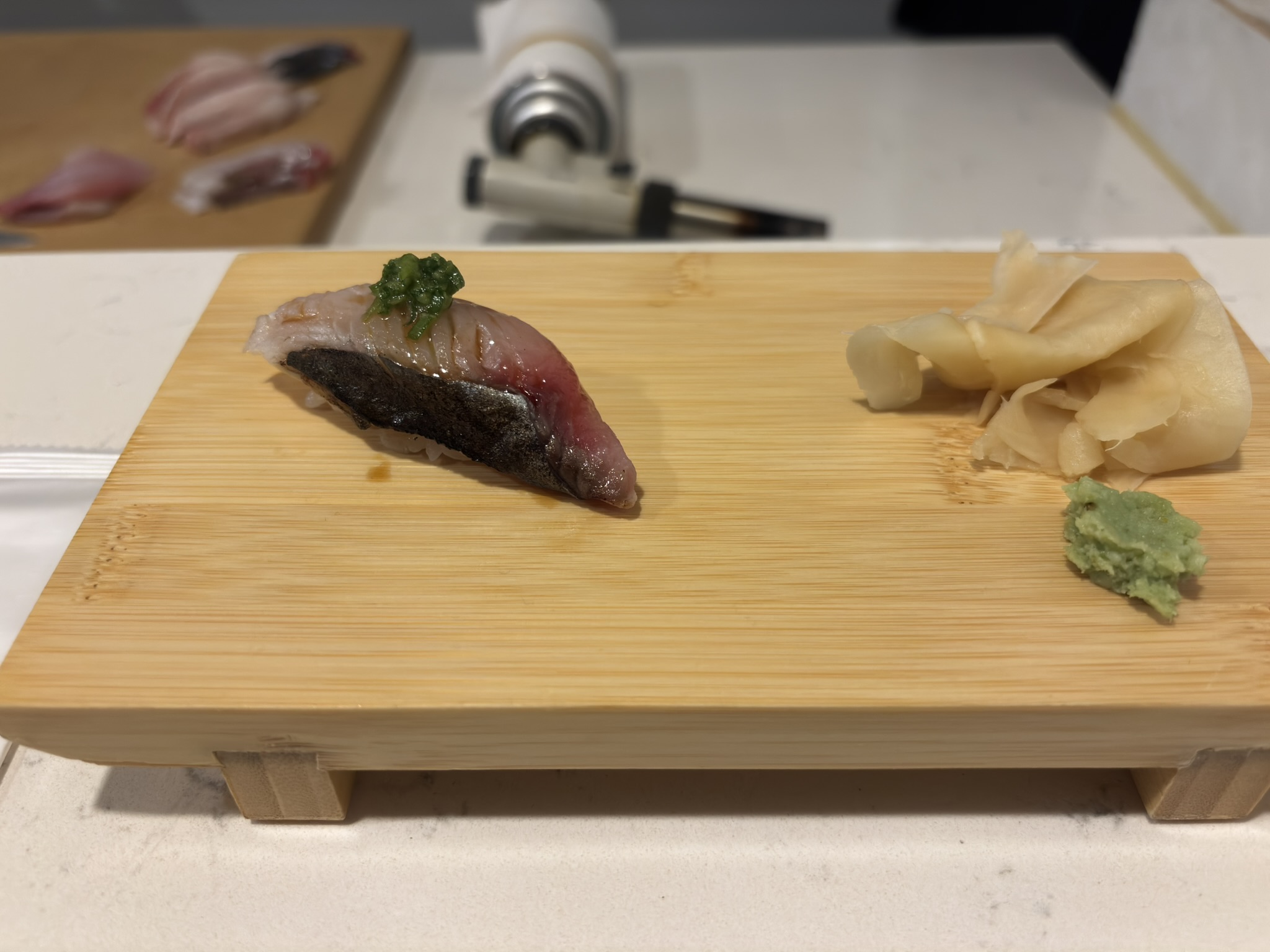 Silver-skinned fish nigiri with scallions at Shinzo Omakase