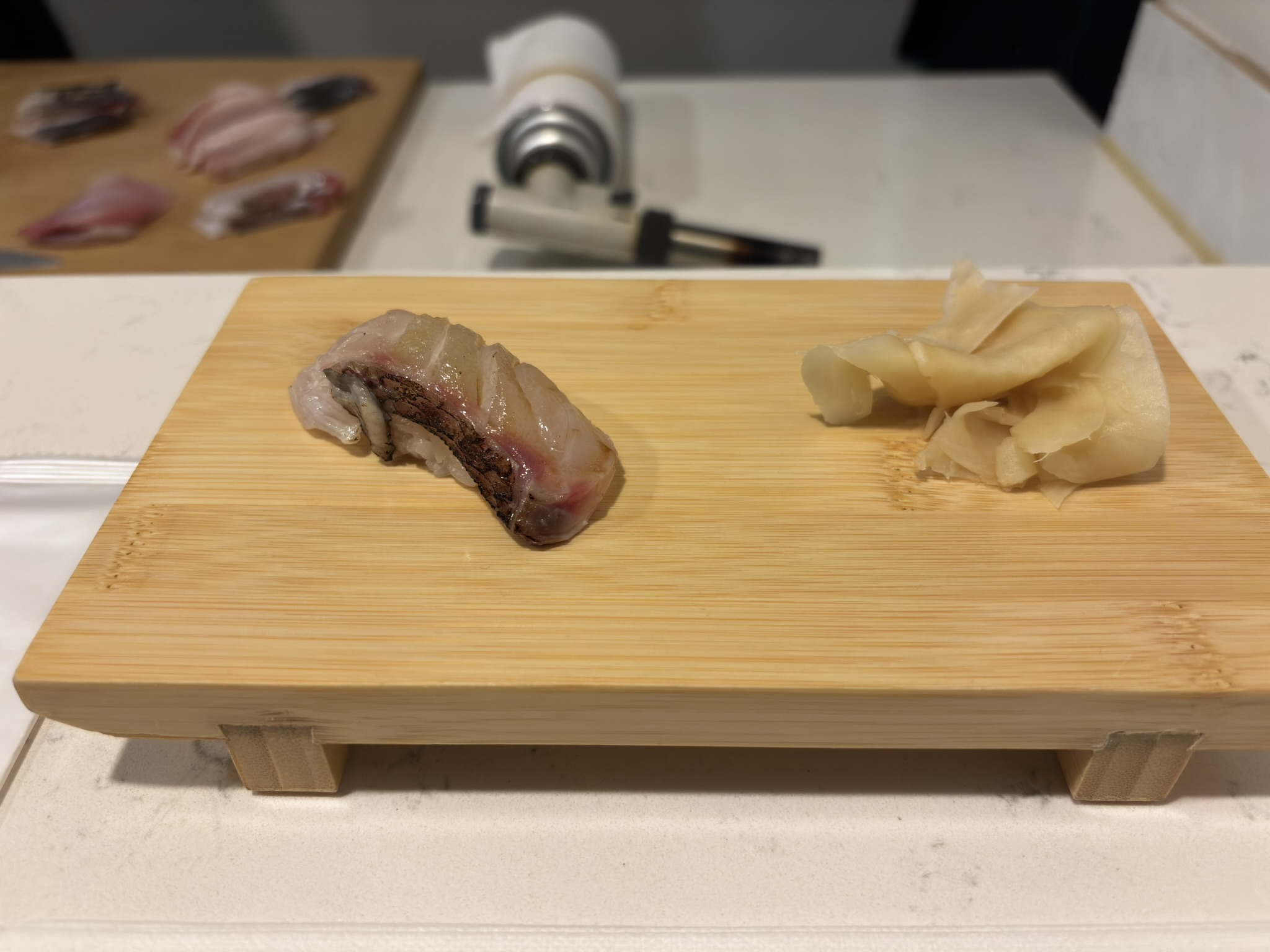 Lightly seared white fish nigiri at Shinzo Omakase