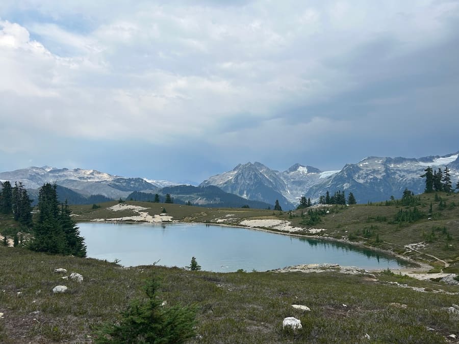 Alpine lake surrounded by rugged mountains