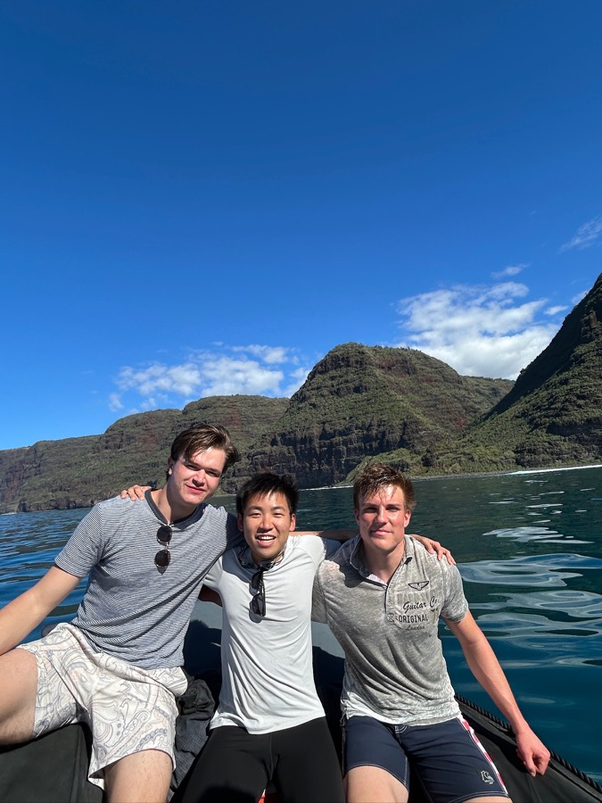 Friends on a boat along the Nā Pali Coast