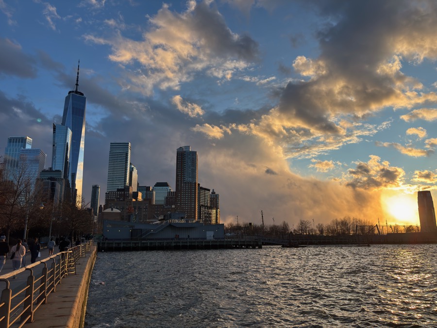 Lower Manhattan skyline at sunset from the waterfront