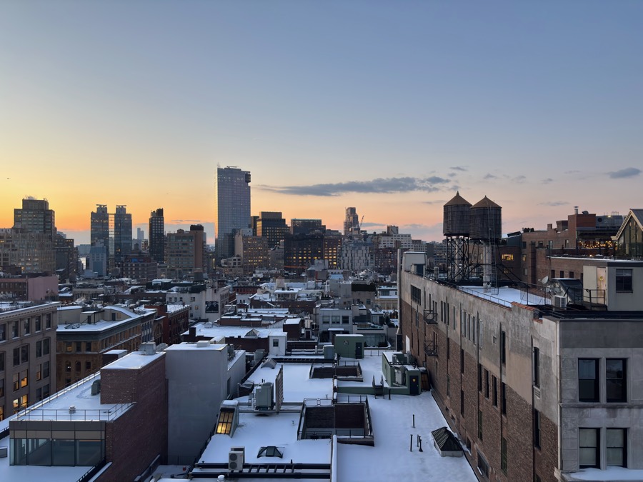 Snow-covered Manhattan rooftops at dusk