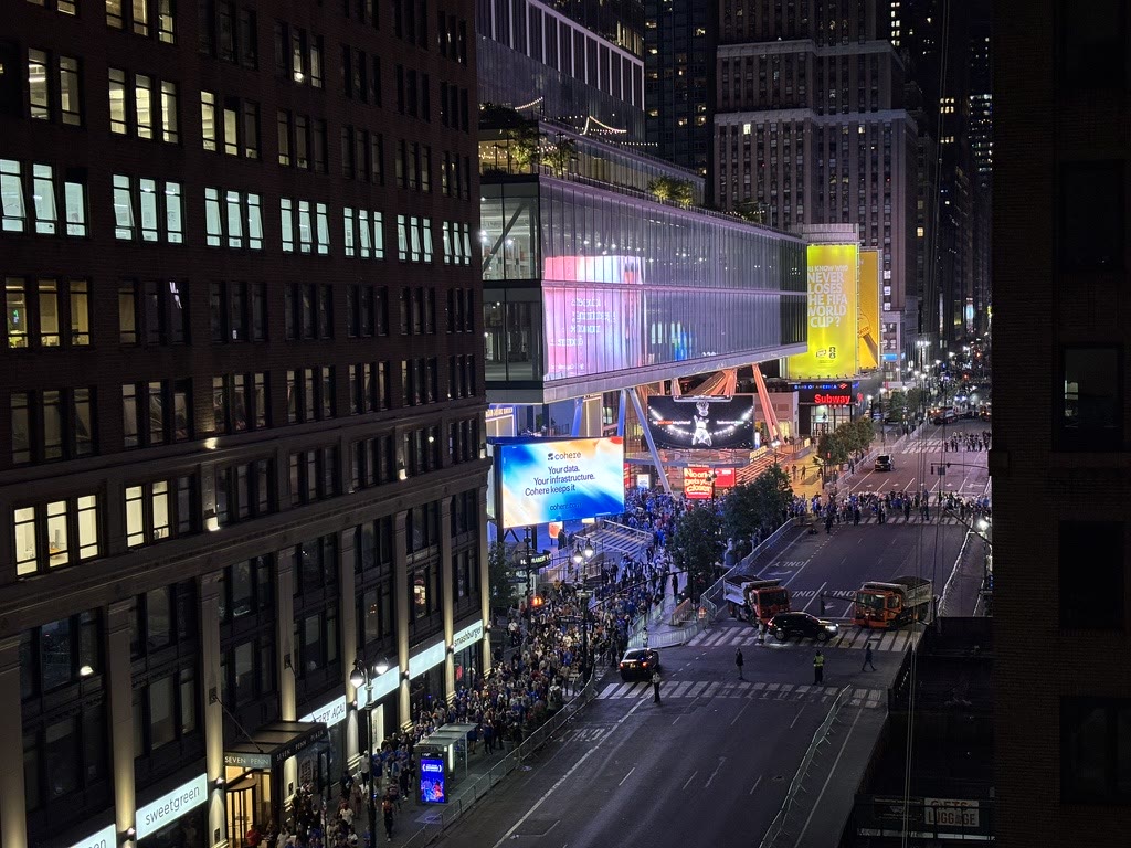 Nighttime view of Madison Square Garden and the crowd from above