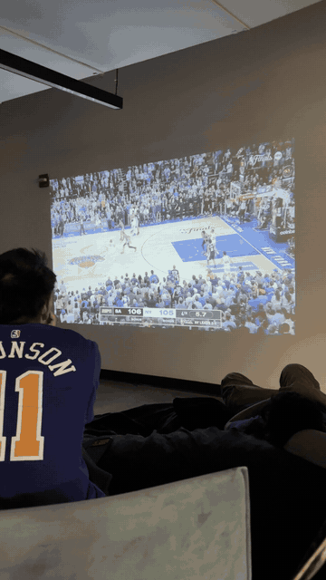 Fans react to the Knicks' game-winning tip-in while watching a projected game
