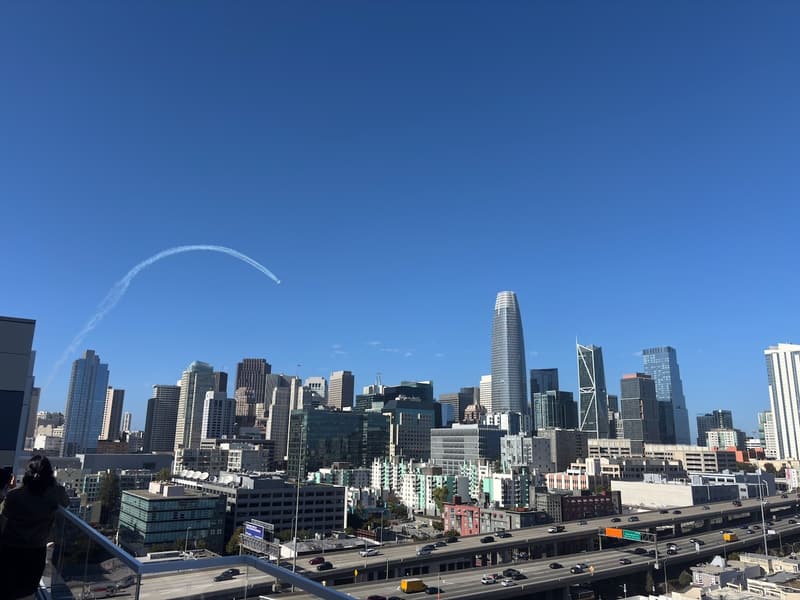 Curved smoke trail above the San Francisco skyline during the October 10, 2026 air show