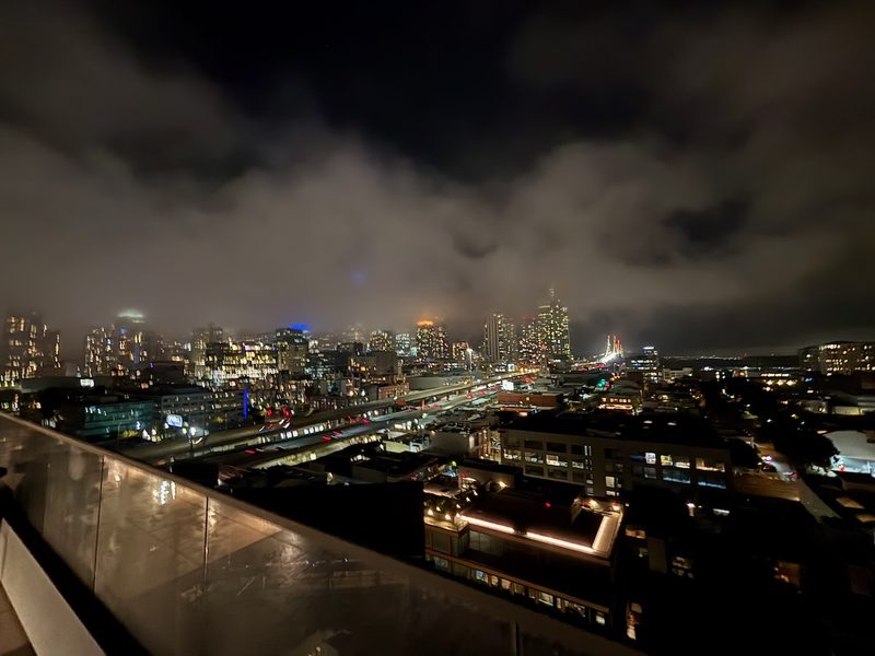 San Francisco city lights and traffic beneath low nighttime fog