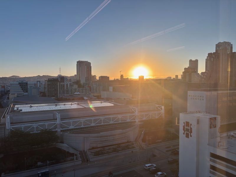 Warm sunset above the Moscone Center and Yerba Buena rooftops