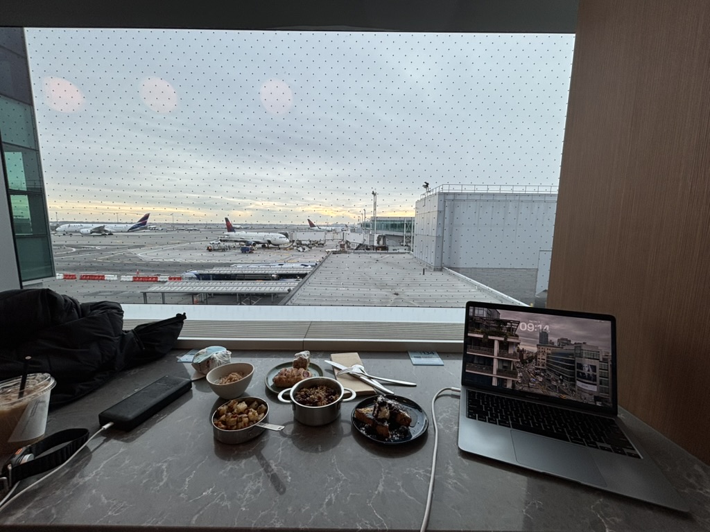 Breakfast and a laptop beside the lounge windows in the morning