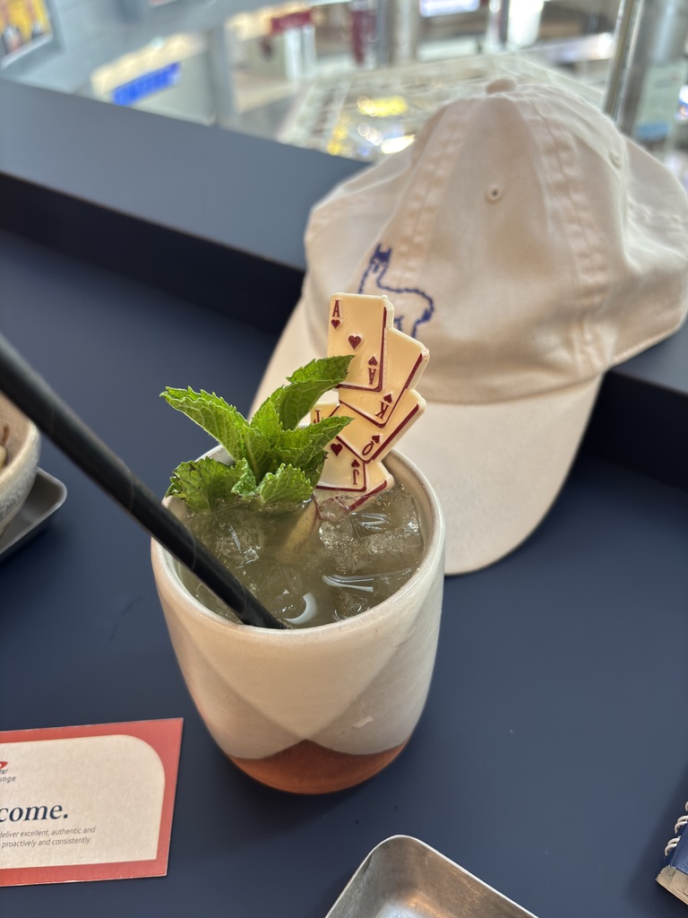 Cocktail garnished with playing cards at the Vegas Capital One Lounge