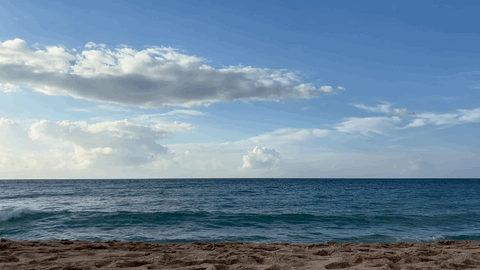 Waves rolling onto an empty beach on Oʻahu's North Shore